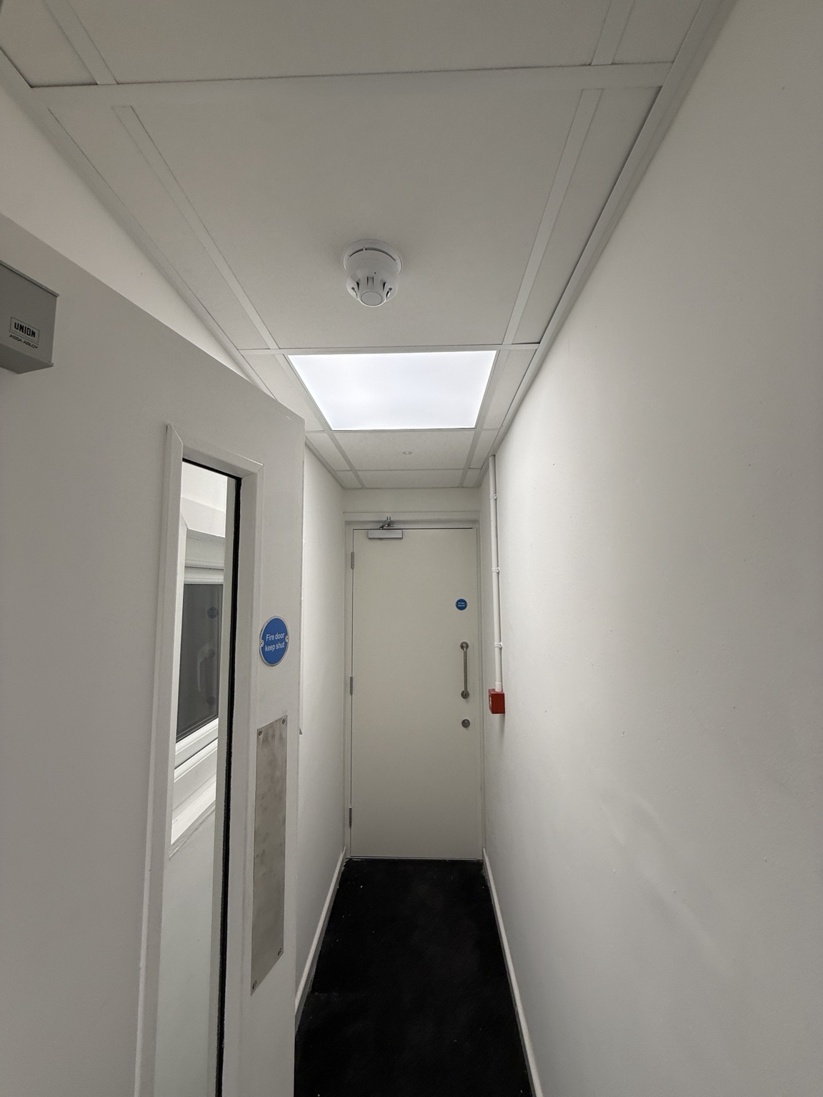Fire detection and emergency lighting installed through the circulation areas